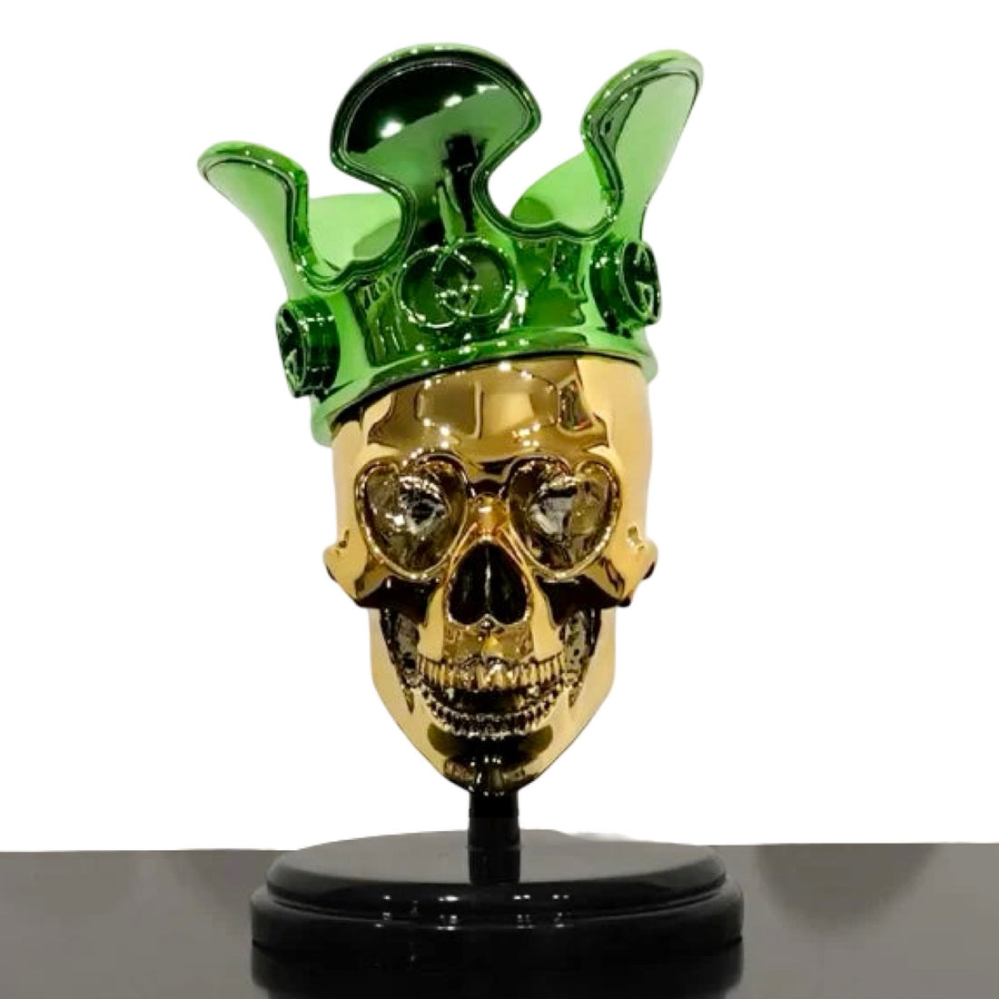 Statue of a golden skull with Green Gucci logo crown