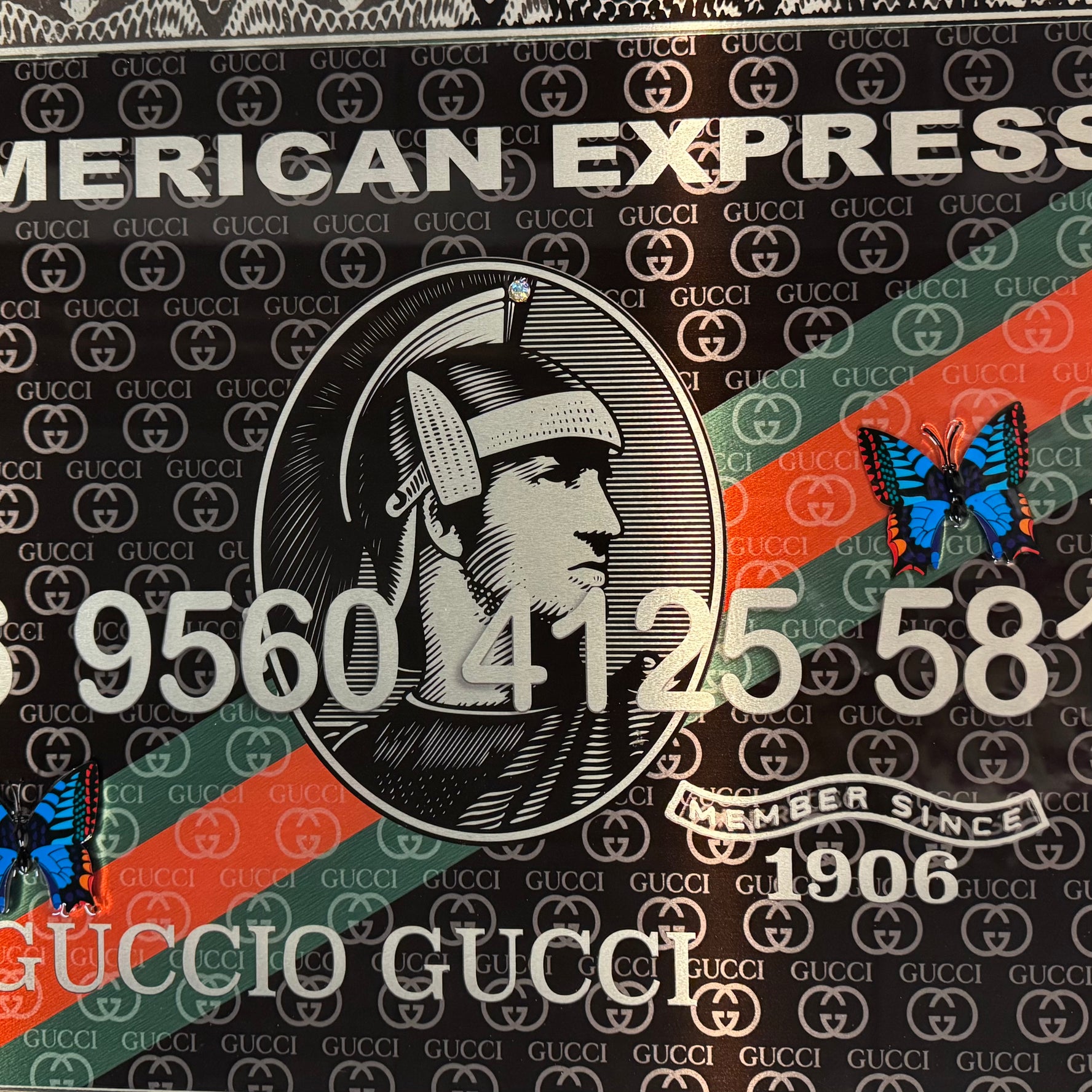 Van Apple Art American Express card Gucci close up