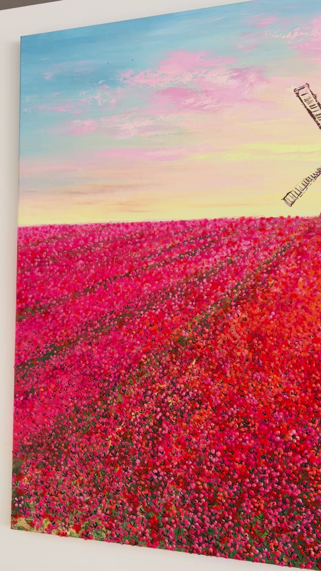 Groot bloemenschilderij voor boven de bank.